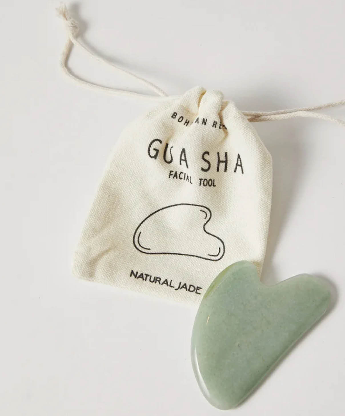 A jade Gua Sha facial tool.