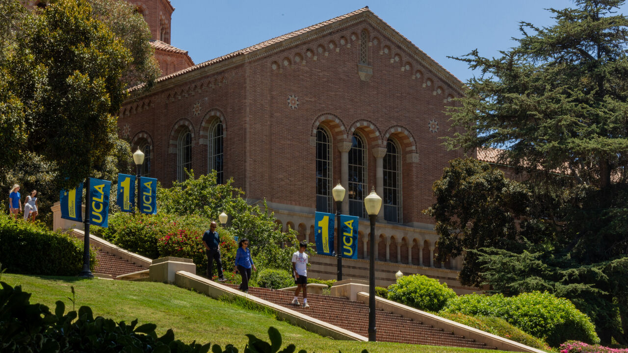 People walk around UCLA in Westwood, California, USA.