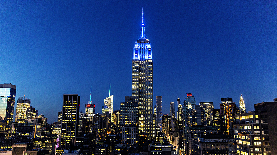 The Empire State Building, illuminated blue for Columbia graduates. Photo by David Dini/Columbia University. The Empire State Building image® is a registered trademark of ESRT Empire State Building, L.L.C. and is used with permission.