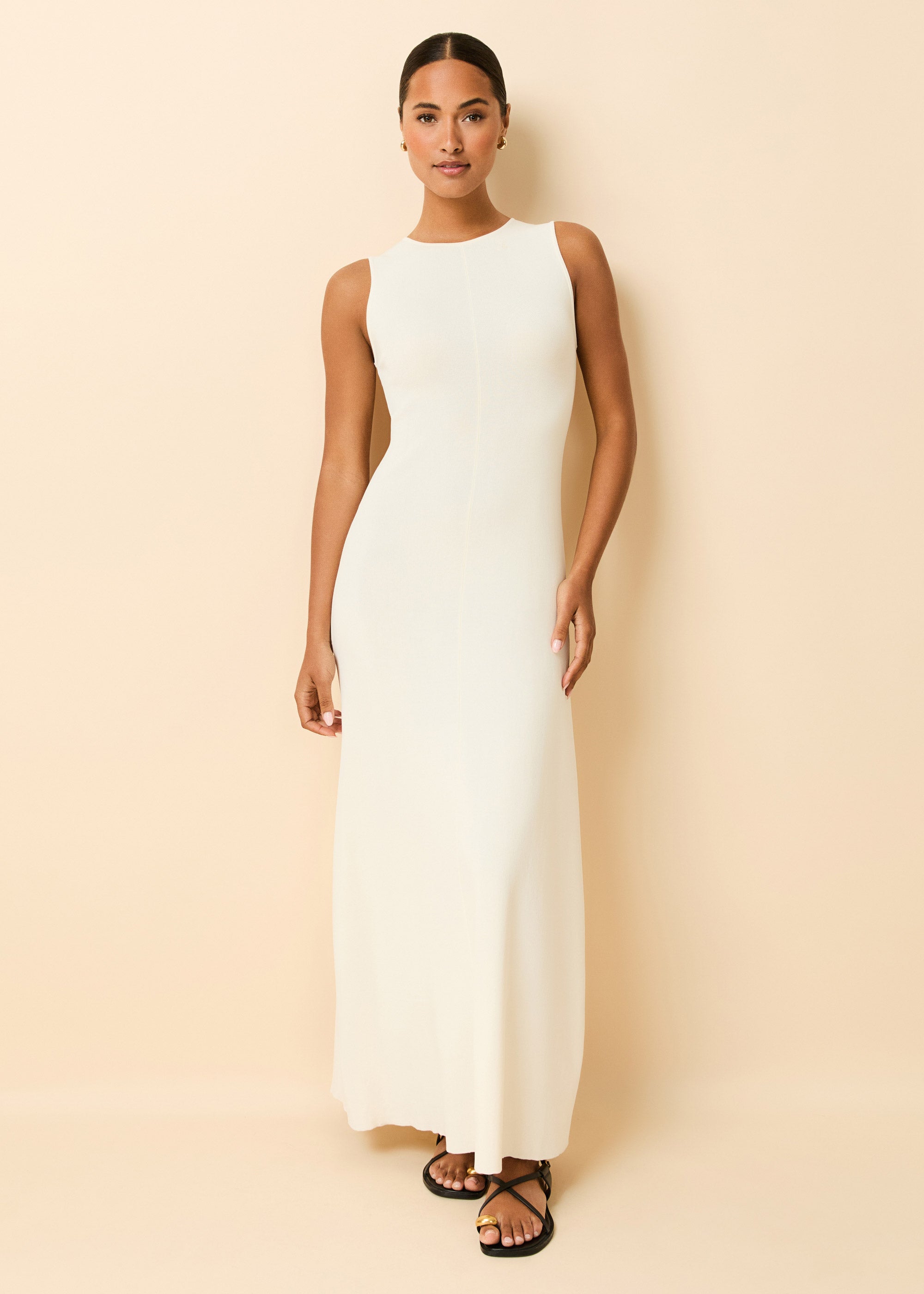 woman in full length strapless off white maxi dress