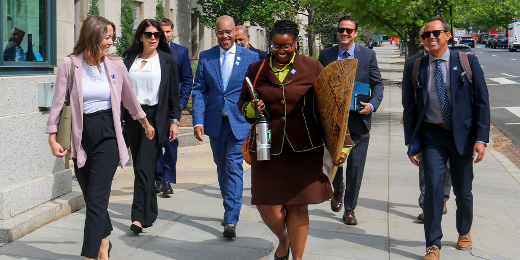 A group of Surfrider staff and business leaders walks the streets of Washington DC.