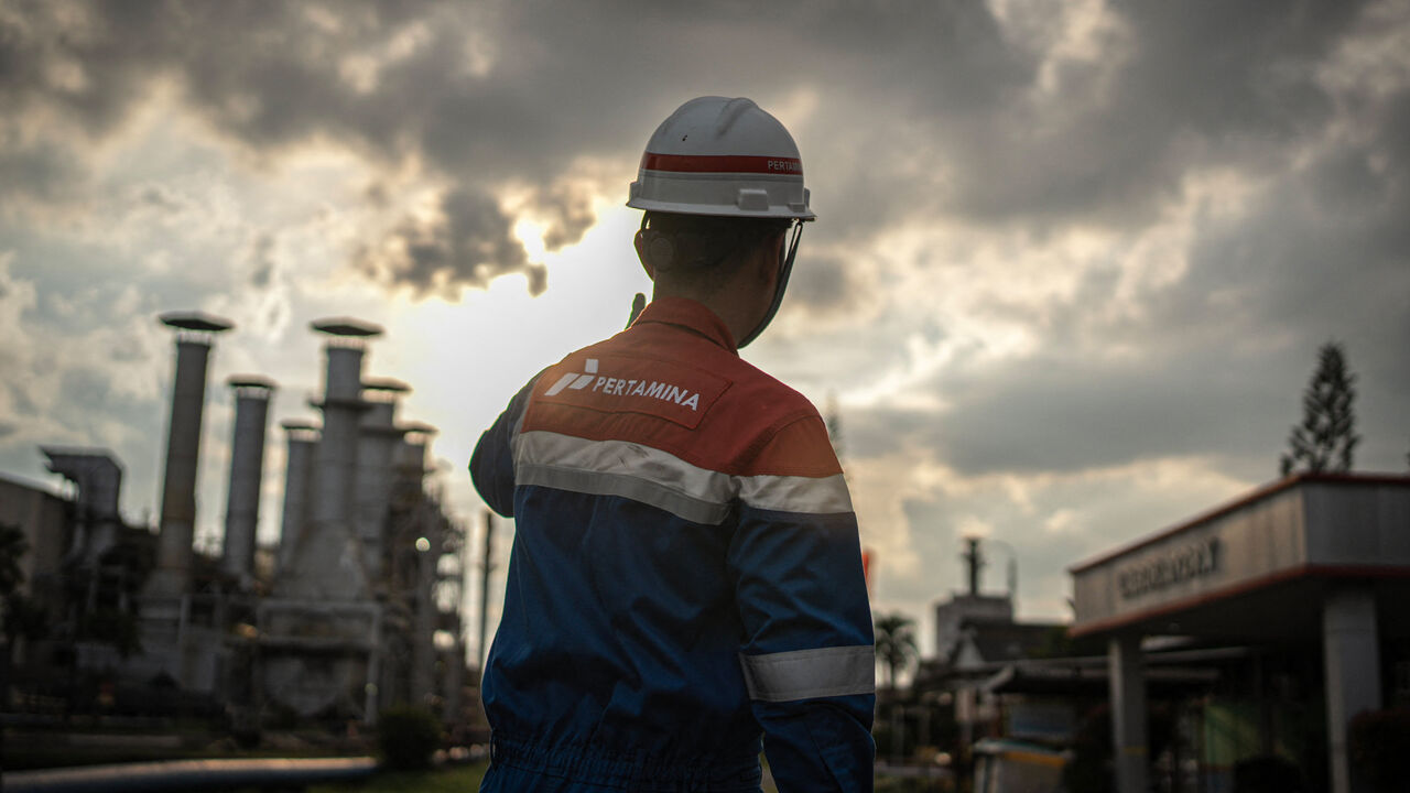 A worker walks at Pertamina Refinery Unit III Plaju in Palembang, South Sumatra.