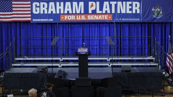 An empty stage is seen at a Graham Platner campaign event.