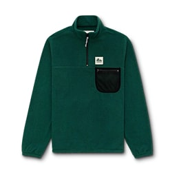 A forest green Aime Leon Dore Unisphere fleece pullover sits on a gray tile.