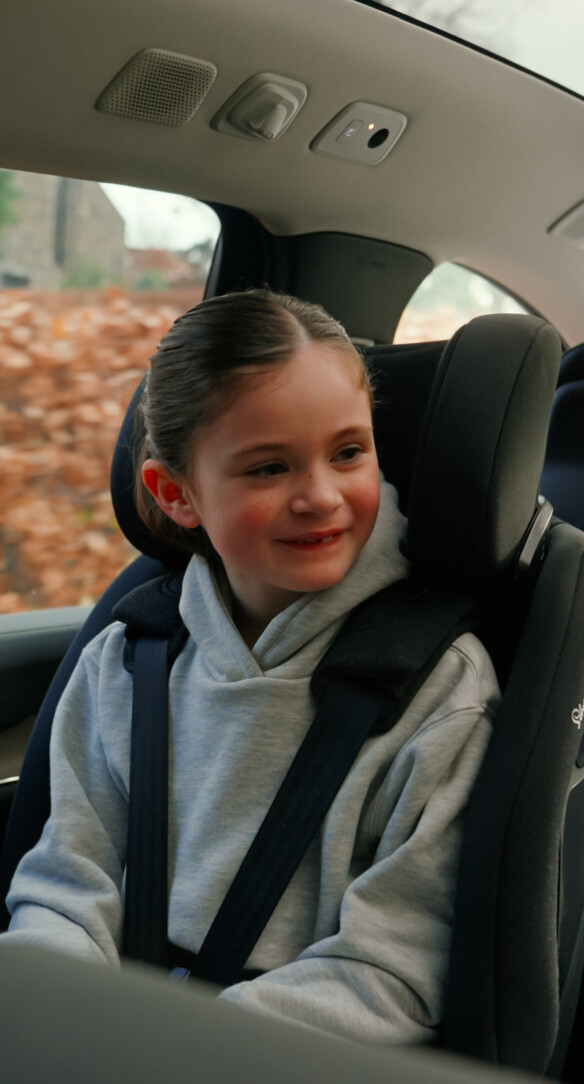 Image of child in rear facing care seat Perform