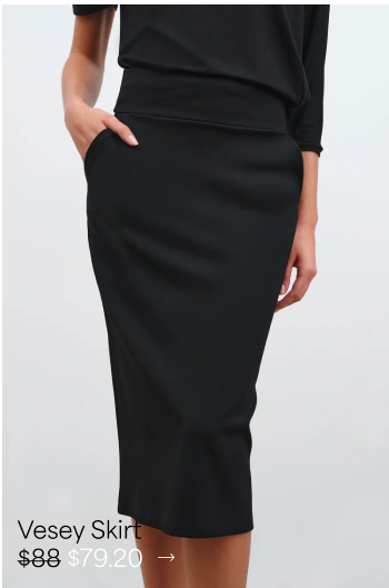 Astrid is shown with one hand in a pocket, wearing The Vesey Pencil Skirt.