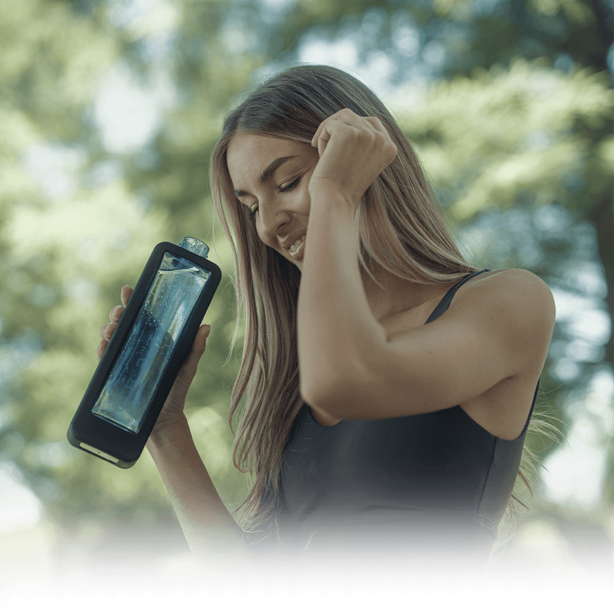 A woman holding an ECHO Flask