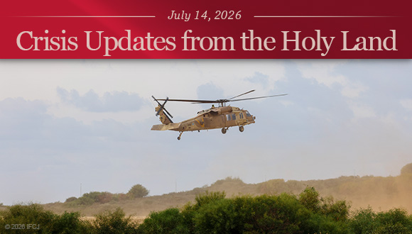 A light brown helicopter flying in the sky, close to the ground.