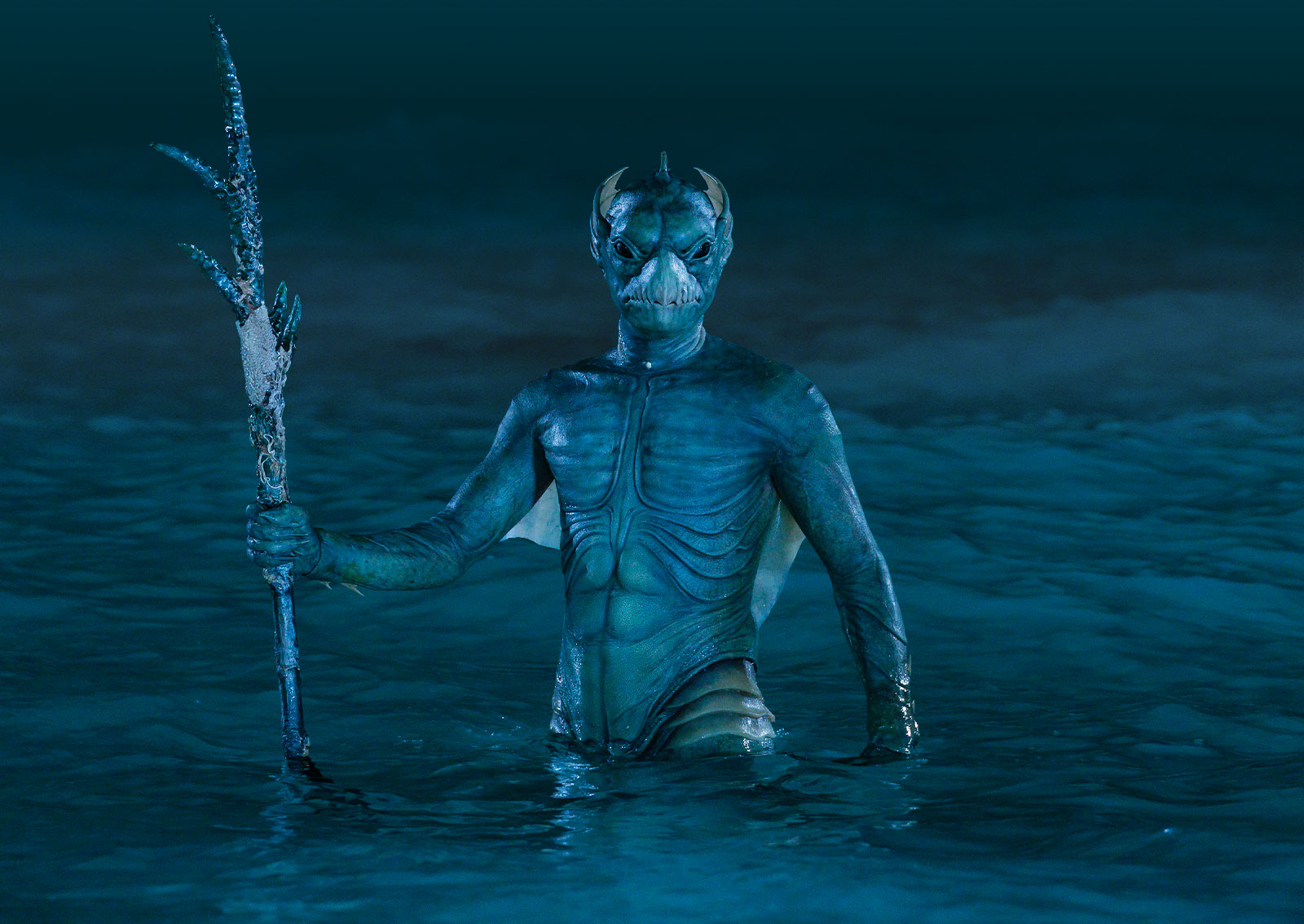 A Homo-Aqua creature, holding a spear and standing in water