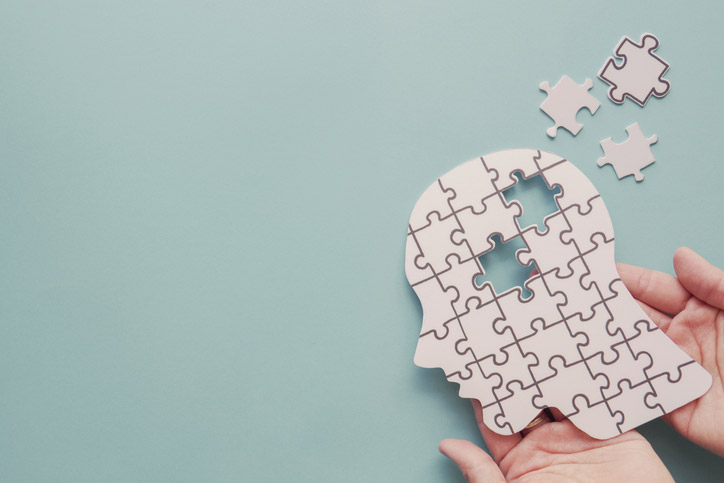 a puzzle of a human head with several 
missing pieces