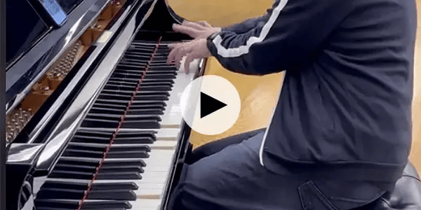 Person playing a Yamaha Disklavier piano