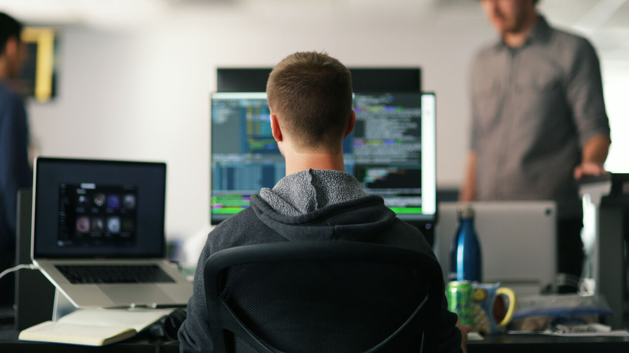 A software engineer working on a computer.