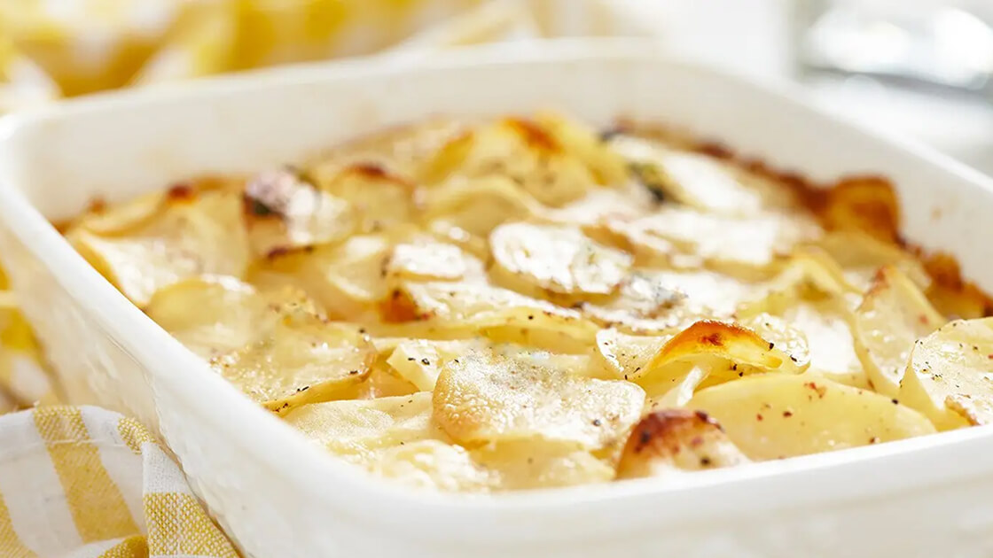 Square dish of scalloped potatoes.