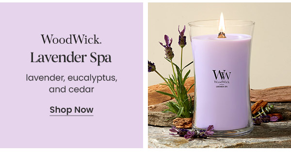 WoodWick Lavender Spa candle with lavender, eucalyptus, and cedar text. Shop now button. Purple candle next to lavender flowers.