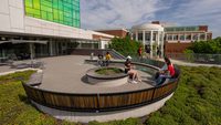 students sit outside IDEA Factory