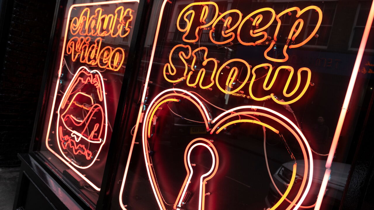 Neon signs for a peep show and adult video in Soho