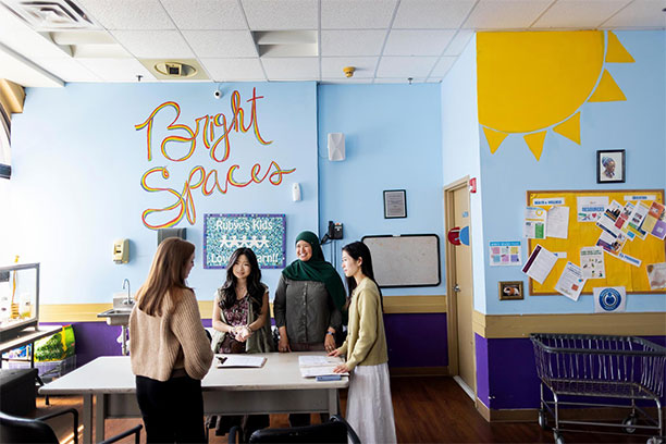 The HAVEN team with Liz Donaghue, assistant shelter director, in Jane Addams’ Bright Spaces room.