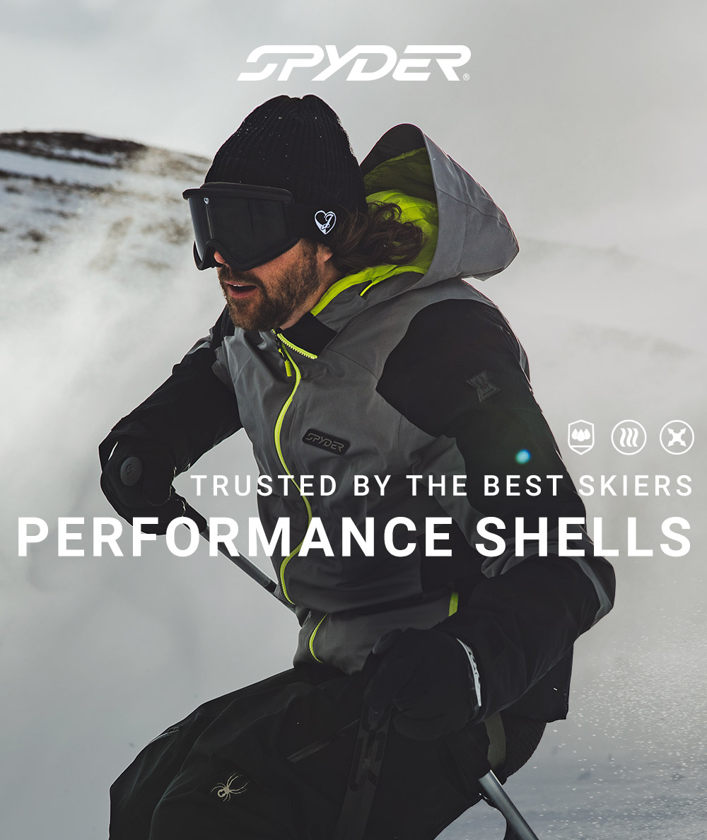 Performance Shells Man Skiing in Black and Grey Kit