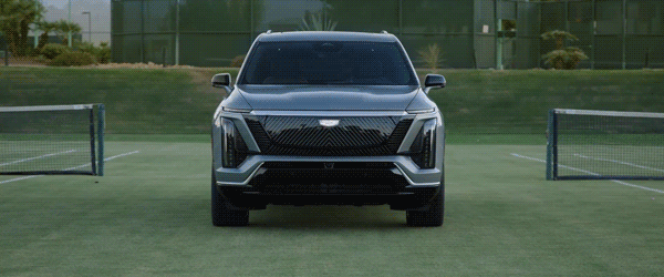 Gif of the the 2026 Cadillac VISTIQ parked in a tennis court with its headlamps turning on and off.
