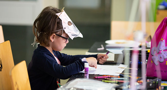 Kid doing a craft