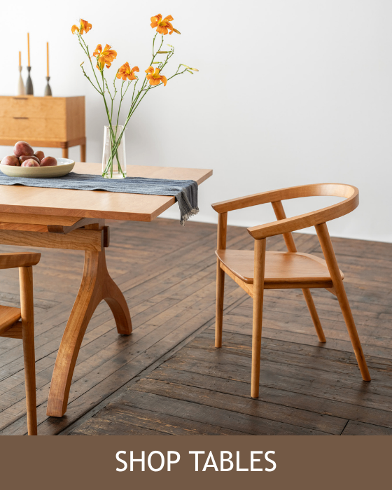 The Wishbone table paired wiht the Cumberland Chair. Shown in the background is the cumberland sideboard also in cherry. 