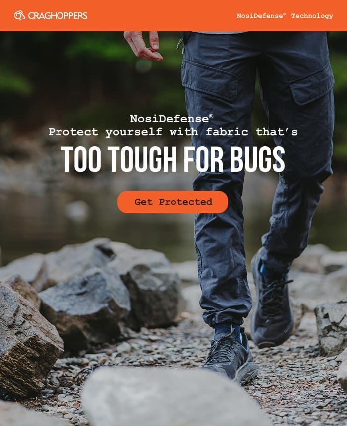 Photo of a man hiking along a creek wearing Craghoppers Nosi Defense pants: Too tough for bugs. Get protected.