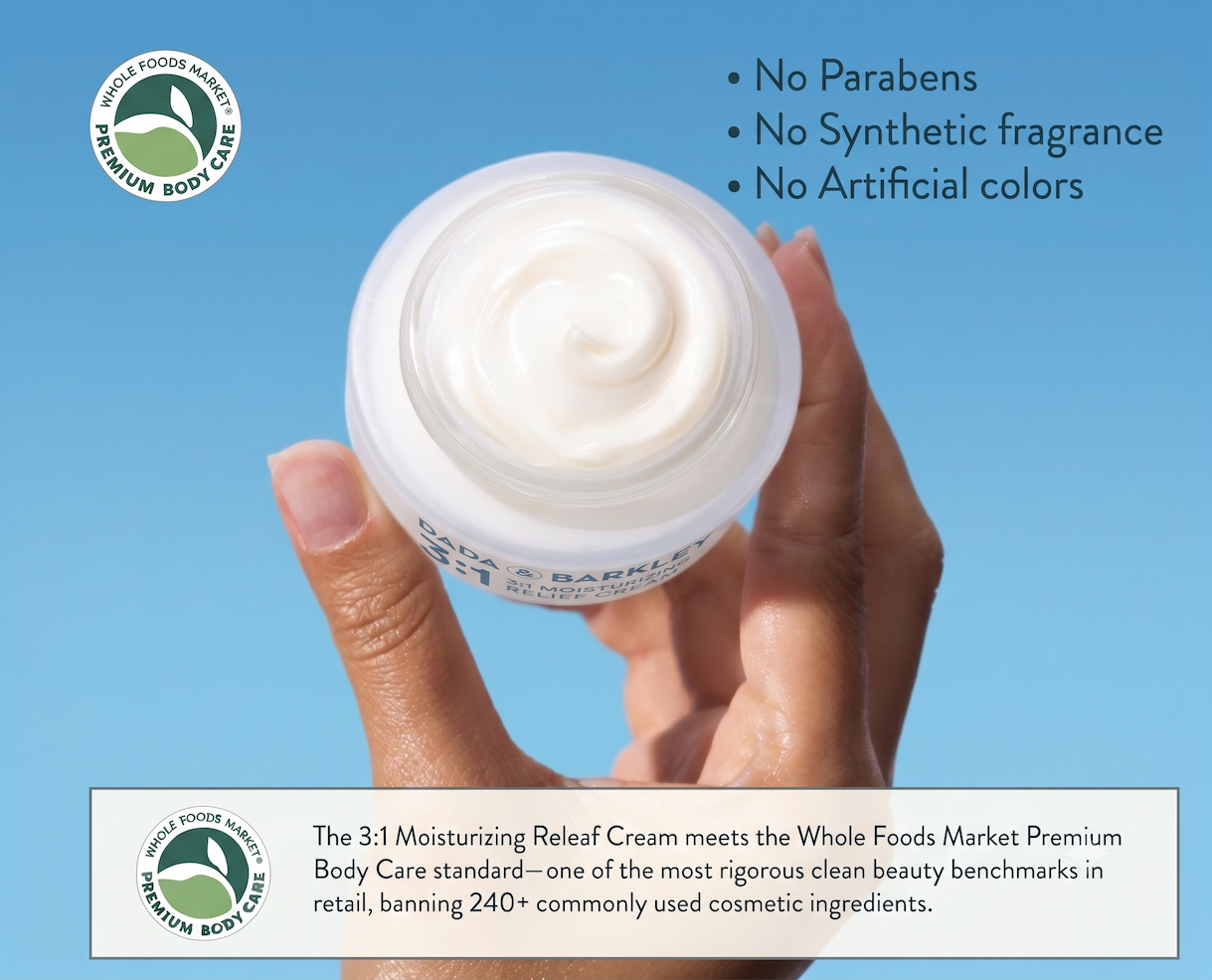 hand holding releaf cream in a container