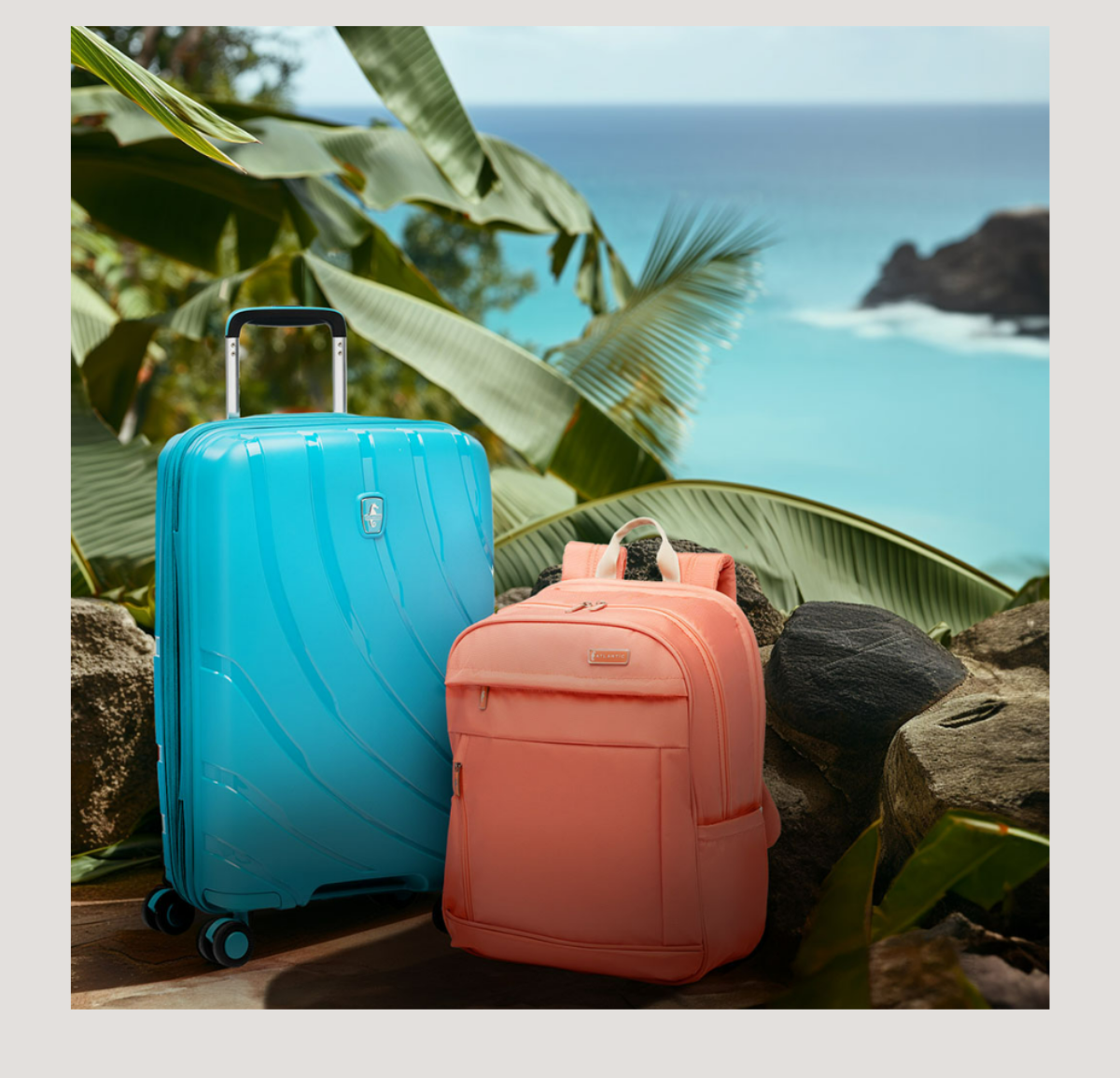 an image of two pieces of luggage sitting on a wooden bench