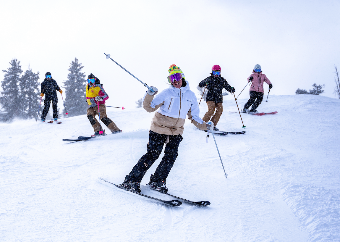 an image of a group of people skiing down a snow covered slope
