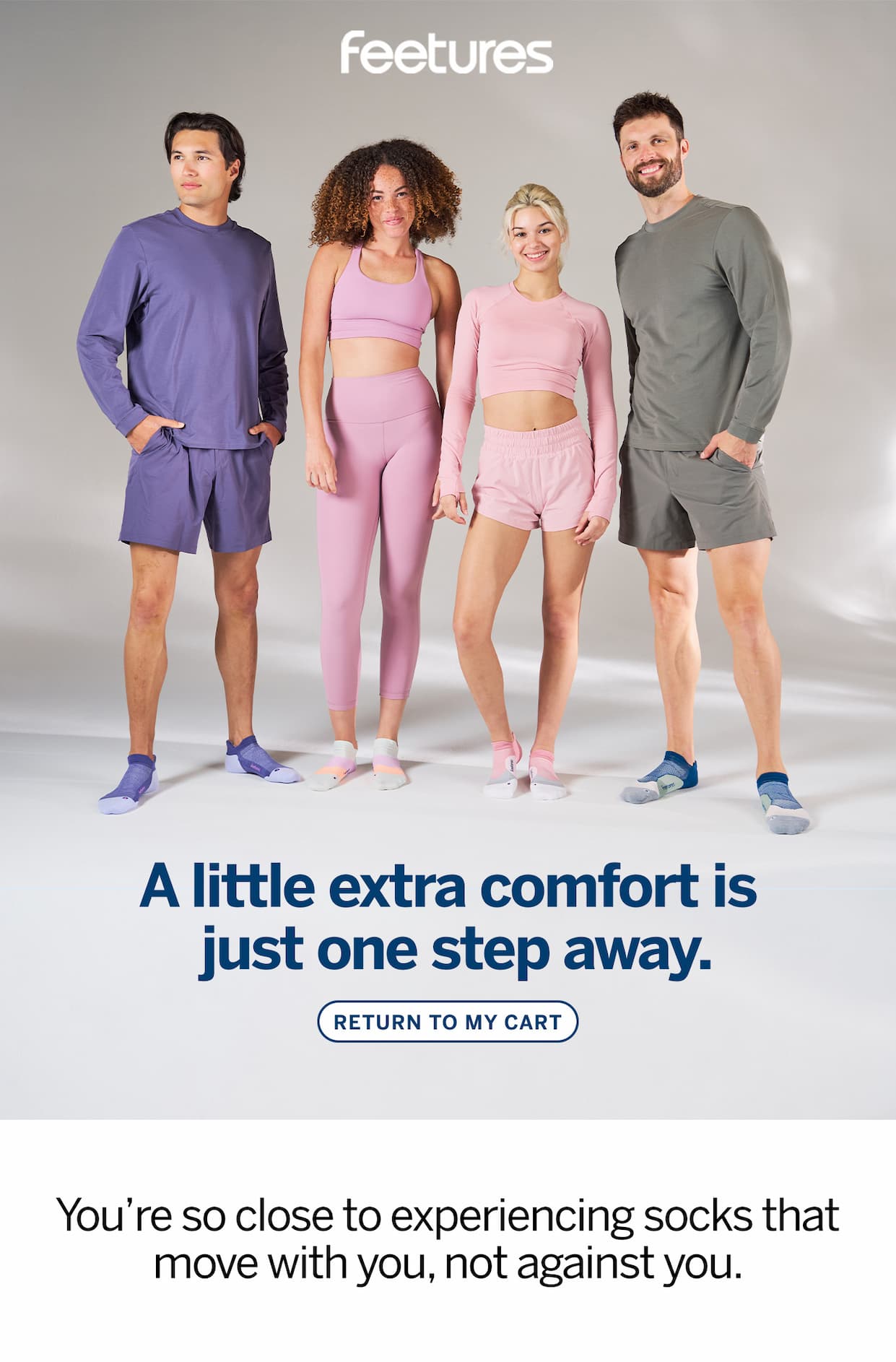 Four people standing with a grey background wearing Feetures Elite tabs with different color schemes. One guy wearing purple, one guy wearing green, one girl in a blue outfit, and one girl in pink.