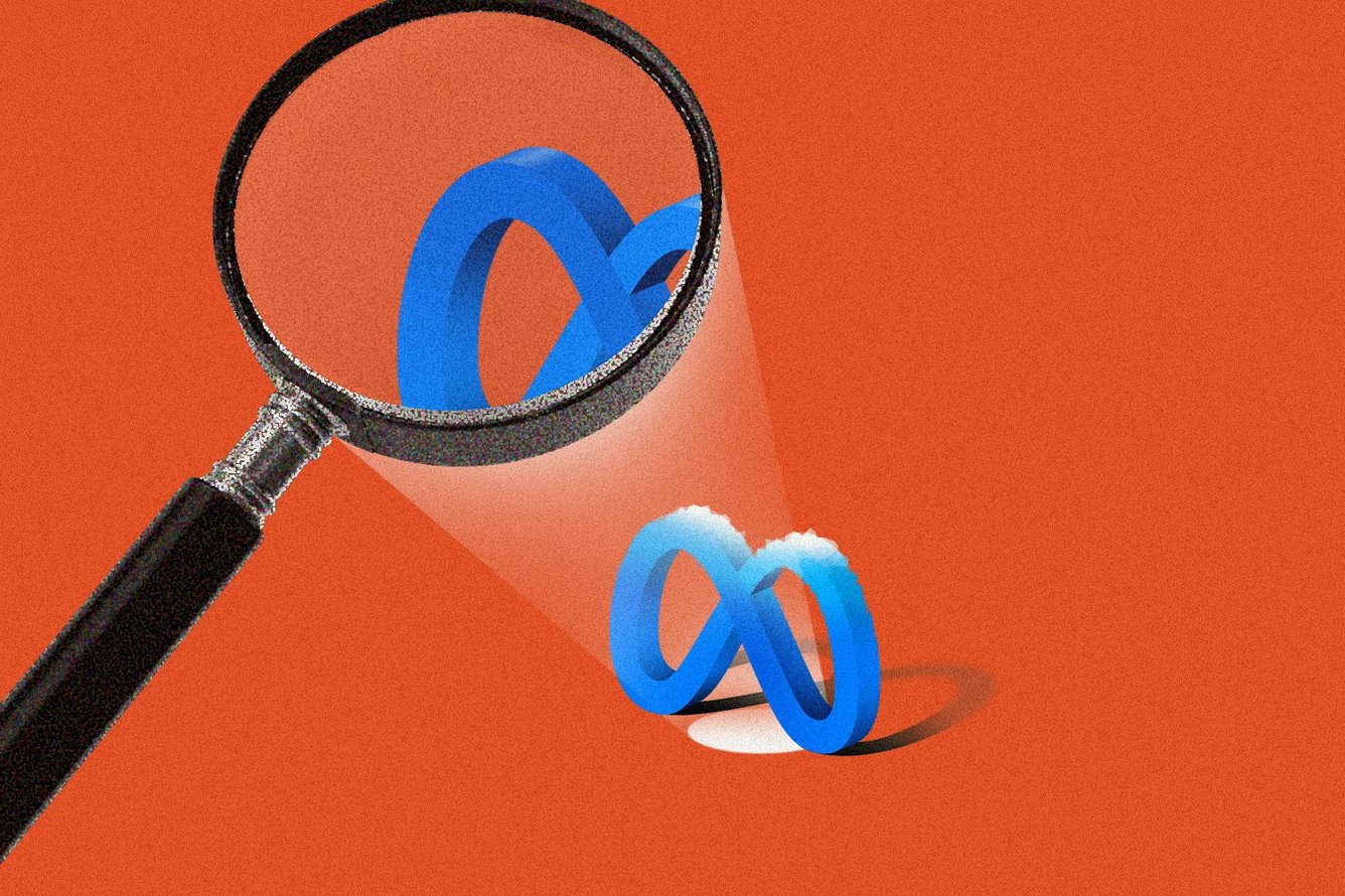 Meta logo under a magnifying glass.
