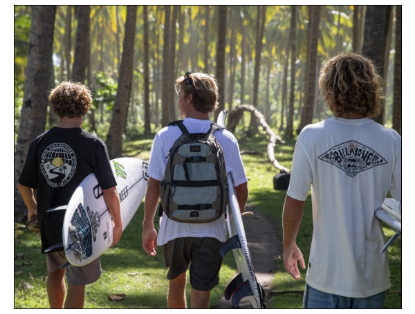 Three guys heading out on a surf trip