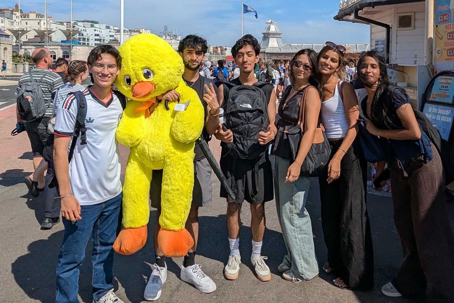 Photo: Jose Alvarez, Mohammad Ali, Rehash Adhikari, Maia Lin, Sabrina Hamideh, Sana Fathima. A student holding a stuffed yellow duck named Craig.