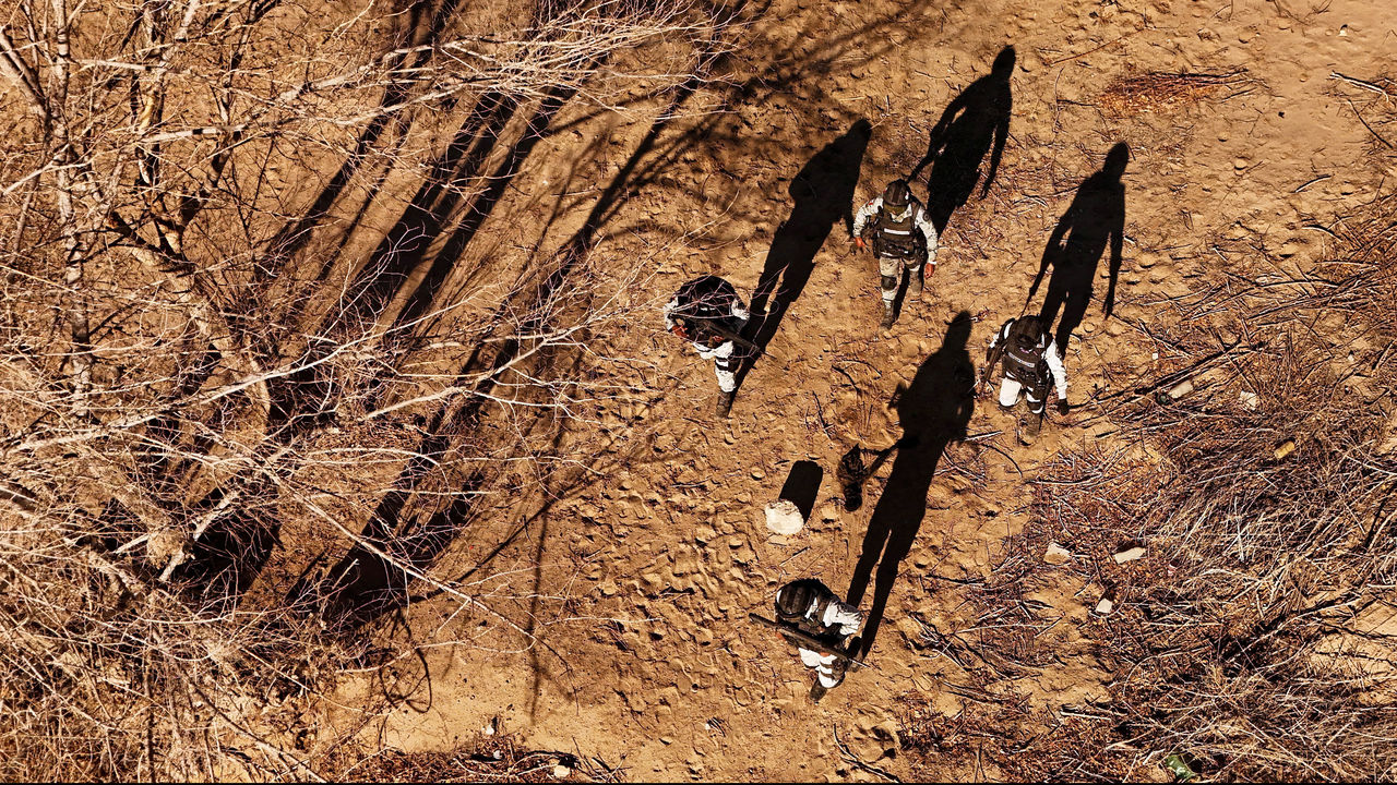 A drone view shows Members of the Mexican National Guard patrol the border wall between Mexico and the U.S.