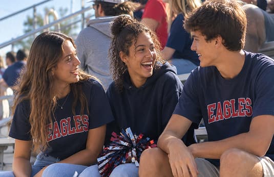 Young school sports fans in the stands