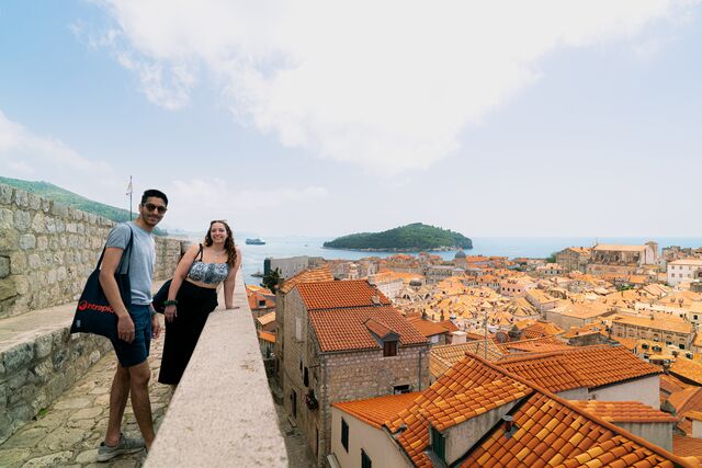 Travellers taking in the view from the city walls in Dubrovnik