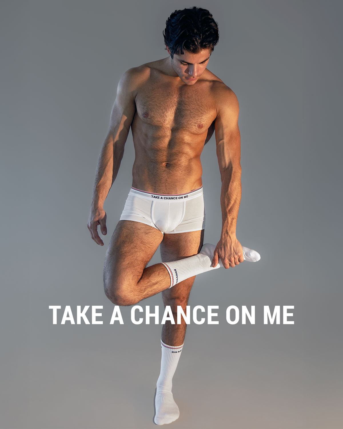 DC2 Take A Chance On Me — model wearing white underwear and matching socks, featured in the PLAY-FM Series campaign.