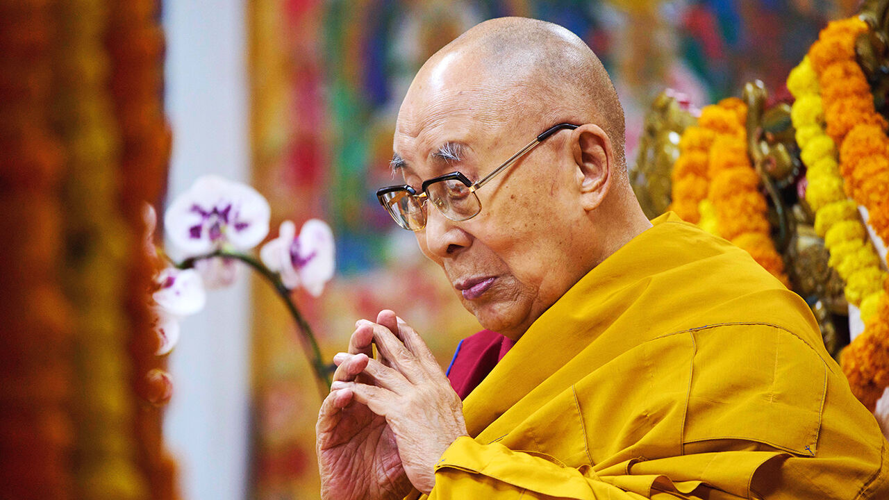 The Dalai Lama prays at an event in Dharamshala, India.