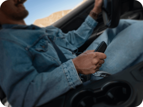 A man in the driver&rsquo;s seat of a Ford Mustang&reg; model