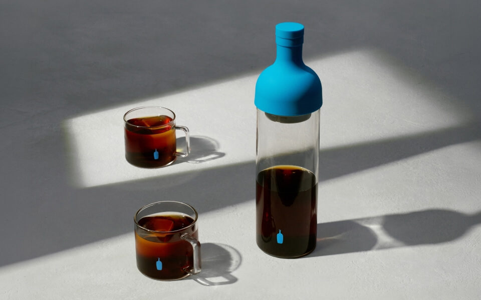 Image of coffee in glasses and bottle.