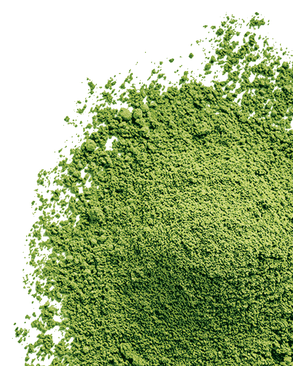Vibrant green powder on an off-white background.
