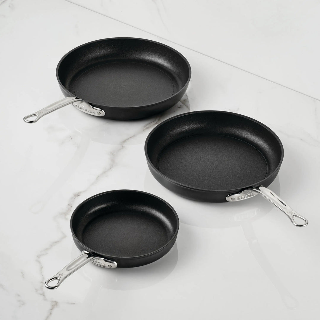 IMG: TITUM® Nonstick Open Skillets on marble countertop