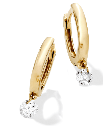 Gold hoop earrings with a single dangling round diamond, polished and elegant.