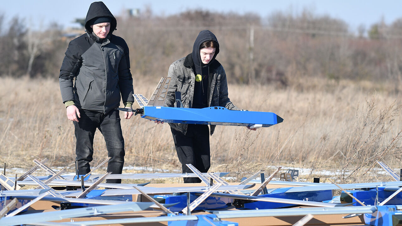 Members of Kozytskyi Charity Foundation stand amid Besomar interceptor drones on February 21, 2025 in Lviv Oblast, Ukraine