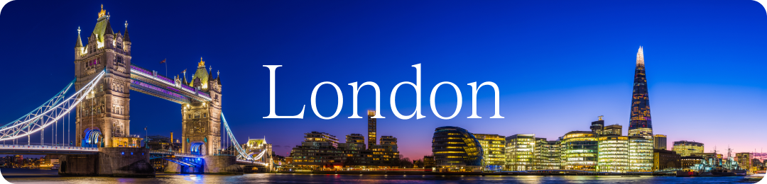London skyline lit up under an evening sky.