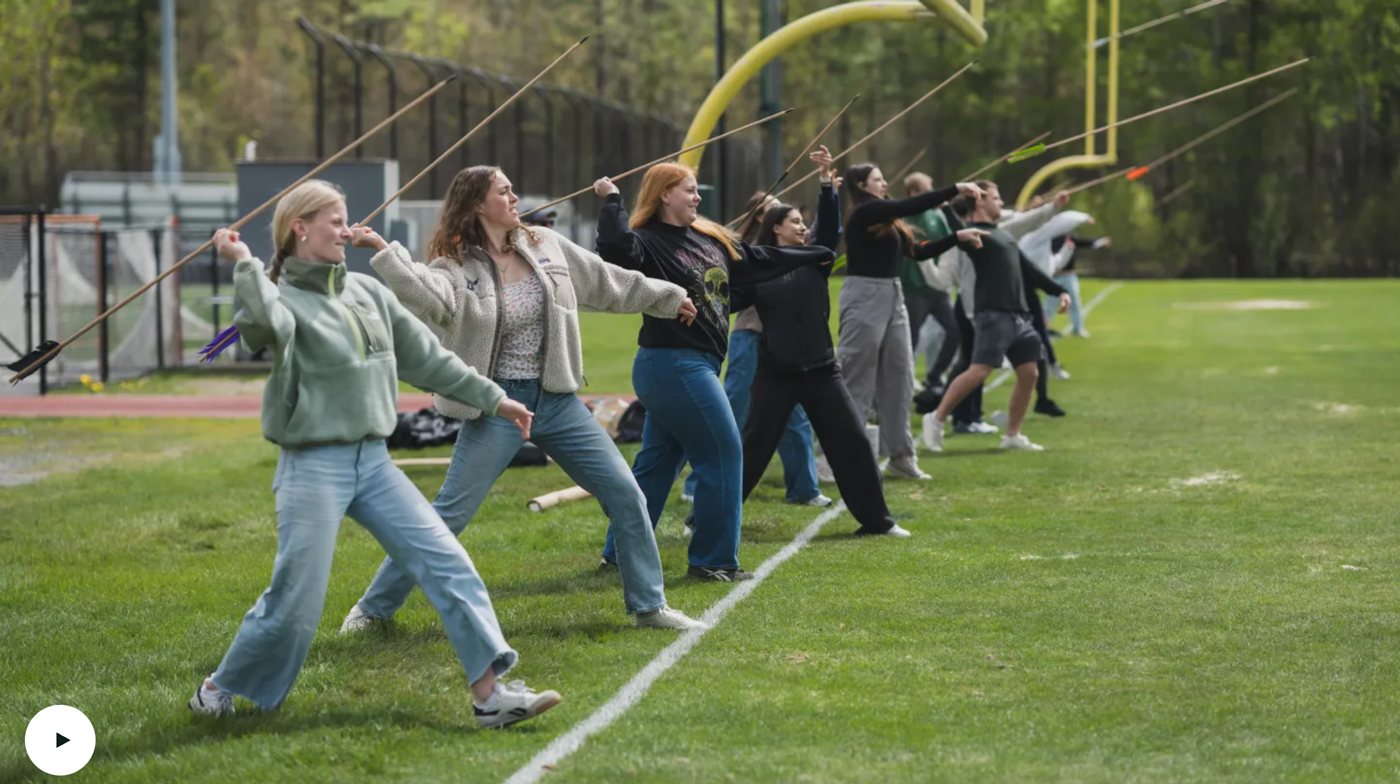 Students throwing arrows for sport