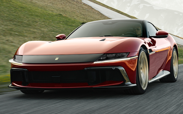 The brand-new Ferrari Dodici Cilindri in a deep red colour, linking to a article on Top Gear's website.
