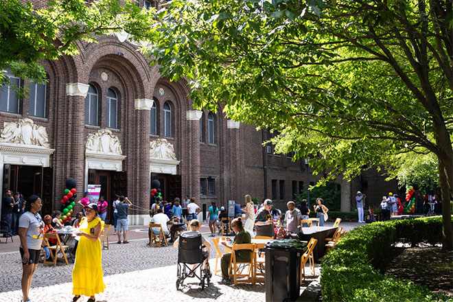 People celebrating a festival outside the Penn Museum.