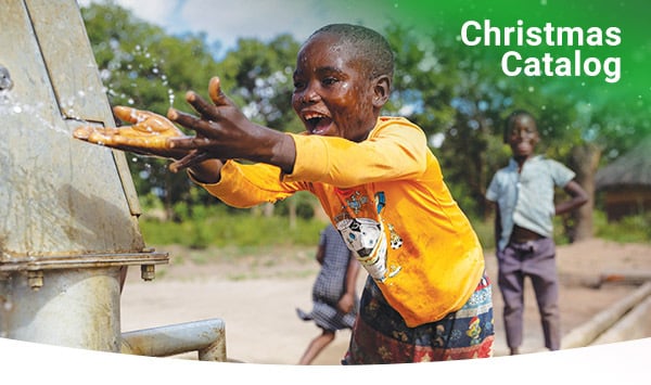 A young boy plays in water in Chibeteka, Zambia