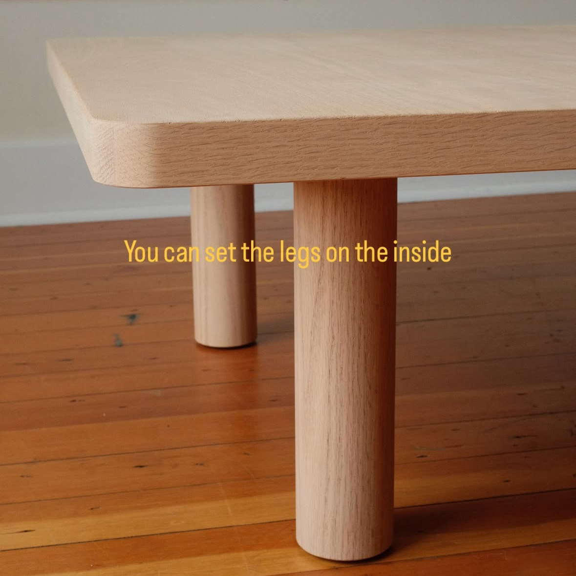 Keeps Modern Coffee Table in Light Natural Finish with Inset adjustable legs
